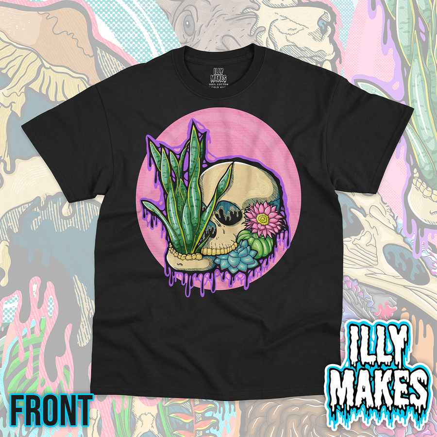 Black unisex tee featuring the Drippy Succulent Skull 1 design by Illymakes, with a skull, tall green snake plant leaves, blue succulents, a pink flower, and purple dripping details inside a pink circular background.