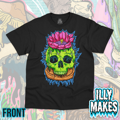 Black unisex tee featuring the Drippy Cactus Skull design by Illymakes, with a bright green cactus skull, sharp spines, large pink flower, terracotta pot, and blue dripping details.