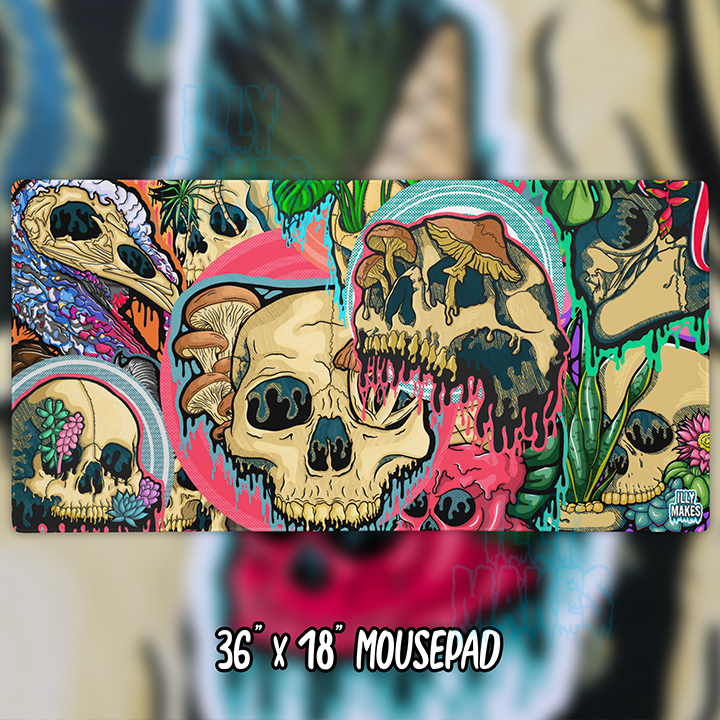 Illymakes gaming mousepad with a colorful collage of dripping skulls, mushrooms, and florals, shown with a keyboard, mouse, and headphones. The text shows 36"x18" MOUSEPAD below.